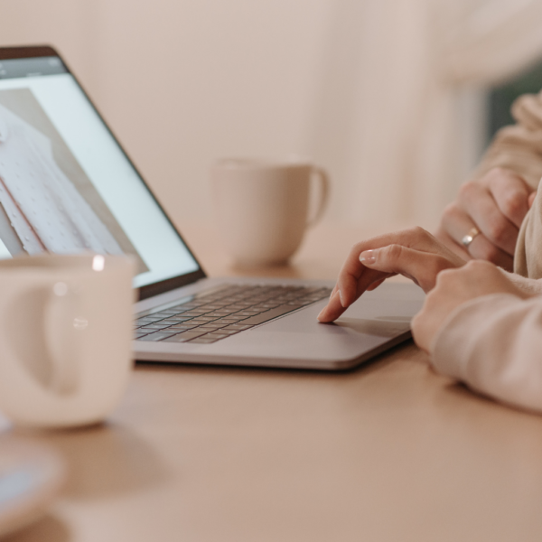 A woman shopping for clothing online at home